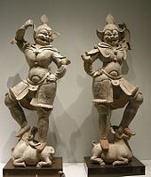 Pair of unglazed lokapala