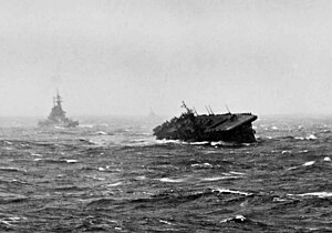 USS Langley (CVL-27) rolling heavily during Typhoon Cobra, 18 December 1944. USS Langley (CVL-27) and battleship in typhoon 1944.jpeg