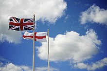 The flag of England flying alongside the flag of the United Kingdom in Southsea, Portsmouth, in July 2008 Union Flag and St Georges Cross.jpg