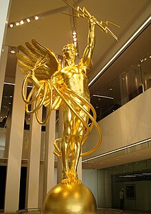 Spirit of Communication, a 20,000-pound (9,100-kilogram) bronze statue, in the lobby of a building