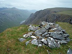 Cairn on the ridge of Beinn Lair. A glimpse of the top end of Lochan Fada can be seen below.