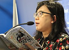 Ng reading a passage of her book Dru and Tale of The Five Kingdoms at the 2019 London Book Fair