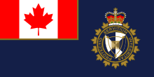 Флаг Управления пограничной службы Канады с геральдическим символом.