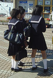 Japanese high school students wearing the sailor fuku