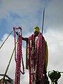 Kapaʻau statue festooned with orchid leis on Kamehameha day