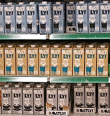 Shelves of Swedish oat drinks in original, organic, and coffee Oatly.jpg