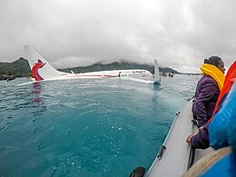 Photograph of passengers being rescued from the aircraft