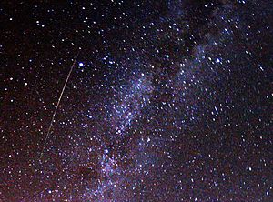 A multicolored, long Perseid meteor striking t...