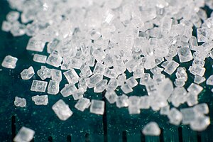 Macro photograph of a pile of sugar (saccharose)
