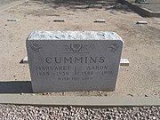 The grave site of Margaret Cummins (1853-1930) and Aaron Cummins (1840-1919). The Cummins were a pioneers who acquired the undeveloped lot 10 of block 1 of the Farmers Addition in 1908. There the family built a house which is listed in the National Register of Historic Places. Cummins is buried in sec. B.
