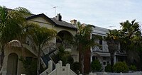 Combinations of Victorian terraces and late Edwardian duplexes and a variety of subtropical palms