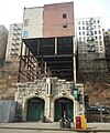 The rear of the building on pylons above the 181st Street subway entrance on Overlook Terrace at West 184th Street.