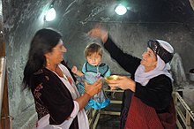 Baptism of a Yazidi child in Lalish Baptizma ezidiyan.jpg