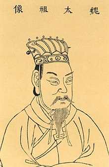 A drawing of a man with a long beard wearing a traditional hat. The image is in black and yellow. On the top are Chinese symbols.