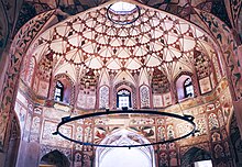 The central chamber of the Shahi Hammam is decorated with frescoes Central dome and fresco painting of Wazir Khan Hammam.jpg