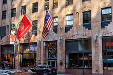 Over a dozen Cornell University programs are based in the General Electric Building in Manhattan. Cornell University flag at 570 Lexington Avenue.jpg