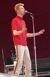 A man singing into a microphone