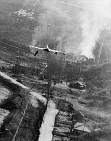 A USAF Lockheed P-80 Shooting Star dropping napalm in Korea, May 1952 F-80C dropping napalm Korea May1952.jpg