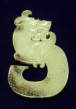 Jade. A jade dragon from the Han Dynasty, China. Jade can be many different shades of green.