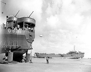 LST-325 (left) and USS LST-388 unloading