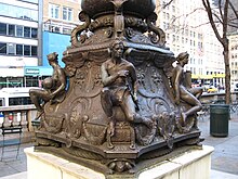 One of two bronze flagpole bases at the 42nd Street entrance, sculpted by Raffaele Menconi NYPL North Flagpole raw jeh.JPG