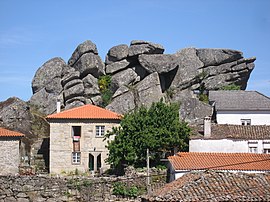 Granite outcrop among village houses, Penela da Beira