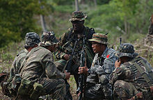 U.S. Special Forces soldier and infantrymen of the Philippine Army SF Soldier in Philippines.jpg