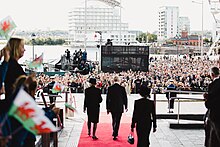 The King and the Queen Consort departing the Senedd after receiving a motion of condolence The Presentation of a Motion of Condolence to His Majesty King Charles III, 16 September 2022 Cyflwyno Cynnig o Gydymdeimlad a'i Fawrhydi y Brenin, 16 Medi 2022 (53216402752).jpg