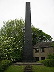 Monument to John Wilkinson approx. 17m north of Junction with Dixon Wood Close