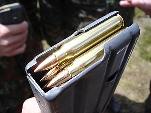 Picture of a 5.56 x 45 mm NATO cartridge in a ...
