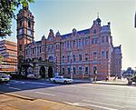 Multi-storeyed red brick building with roof of copper and corrugated iron. Plastered mouldings and f The Pietermaritzburg City Hall stands in Commercial Street, between Church and Longmarket Streets. It occupies the site where the Voortrekkers built the 'Volksraadsaal' or National Council Chamber of the Republic of Natalia. The 'Volksraadsaal' was commen Architectural style: Flemish Renaissance Style. Type of site: City Hall Current use: city hall. The City Hall has great historical and architectural importance, is a work of a recognised master an...