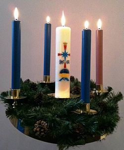 On Christmas Eve, the Advent Wreath is traditionally completed with the lighting of the Christ Candle in many church services. Adventwreath.jpg