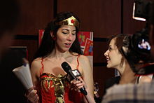 Journalist interviewing a cosplayer Cosplayers at Comicdom 2012 in Athens, Greece grant interviews to the MTV television channel 21.JPG