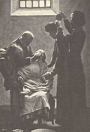 English: A suffragette on a hunger strike bein...