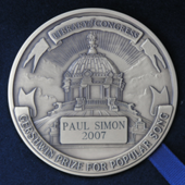 Reverse of the 2007 Library of Congress Gershwin Prize for Popular Song medal awarded to Paul Simon Gershwin Simon 2007 Rev.png