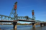 Green metal bridge with lift rising