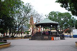 Main plaza wi kiosk an mission kirk in backgrund