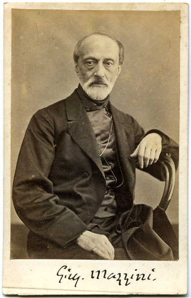 Black and white photographic portrait of Giuseppe Mazzini by Domenico Lama (1823-1890) with G.M.'s signature at the bottom.