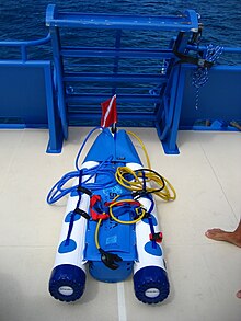 A raft used for snuba showing the air cylinder and hoses Snuba Flotation Raft and hoses.JPG