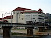 A Hankyu train passes in front of Takarazuka Grand Theater on the Imazu Line in 2003