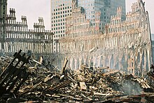 The exterior support columns from the lower level of the South Tower remained standing after the building collapsed WTC-Wreckage-exterior shell of south tower.jpg