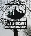 Sign in Woolpit depicting the two green children