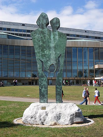 Two parents and a child: the statue Family in the garden of the Palace of Nations (United Nations Office at Geneva) is a commemoration of the International Year of the Child. Family by Edwina Sandys.JPG