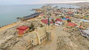 An aerial view of Lüderitz with the Felsenkirche in the foreground and the rest of the town in the background.