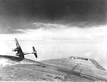 An Me 410A-1/U4 with a BK 5 cannon peels off from attacking a USAAF B-17 Me 410 Hornisse with BK 5.jpg