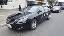 A North Korean police car in 2017; the Choson'gul lettering on the side translates to "Traffic safety". Police car outside Okryu Restaurant.jpg