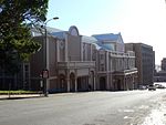 The Port Elizabeth Opera House is an important example of early South Africa theatre architecture. Rehabilitated by stauch, Voster, Vos and Philip (1985). This building in the late Renaissance style, based broadly on the Doric Order, was designed in 1891 by Mr G. W. Smith, a prominent Port Elizabeth architect and was built by the firm Small and Morgan. The Opera House was opened ceremoniously on 1 December Architectural style: Victorian Renaissance. Type of site: Opera House.