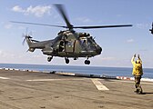 Singapore Super Puma lands on USS Inchon (MCS-12) 2001.jpeg