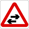 Two-way traffic crosses a one-way road