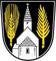 Gemeinde Edelsfeld In Schwarz eine wachsende silberne Kirche mit Turm und Apsis; vorne eine goldene Gerstenähre und hinten ein goldener Palmzweig.
